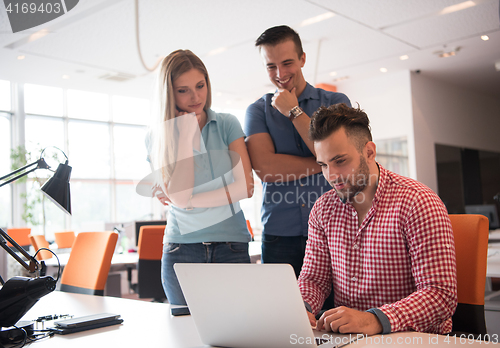 Image of Group of young people employee workers with computer