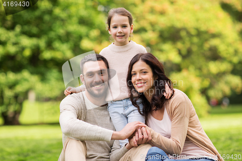 Image of happy family in summer park