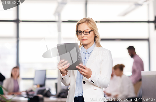 Image of businesswoman with tablet pc at office