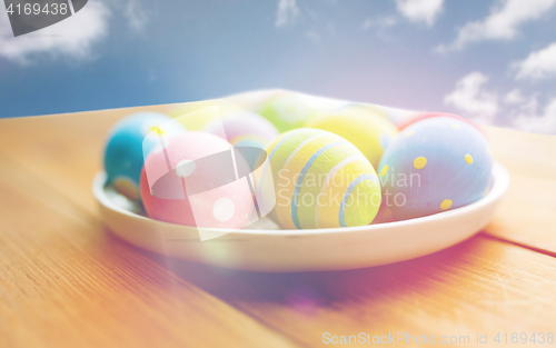Image of close up of colored easter eggs on plate