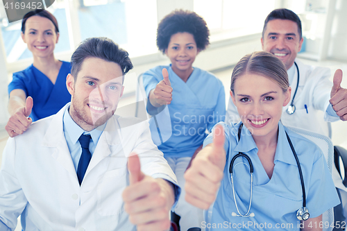 Image of group of happy doctors on seminar at hospital