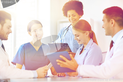 Image of group of happy doctors meeting at hospital office