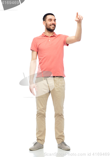 Image of happy man touching something imaginary