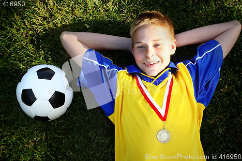 Image of Boy with soccer ball