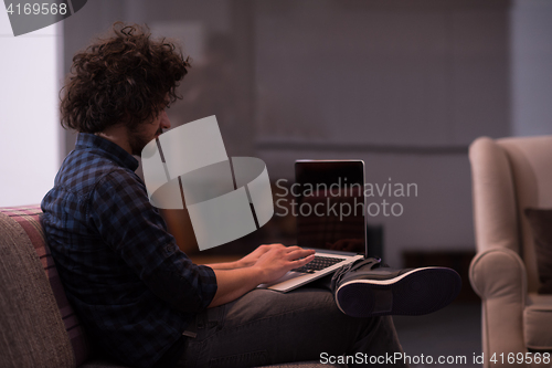 Image of man working with laptop