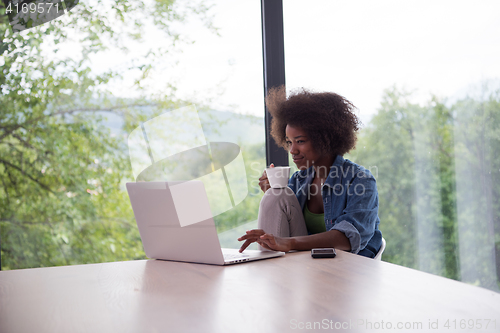 Image of African American woman in the living room