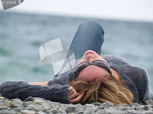 Image of Young lady on Beach Resting