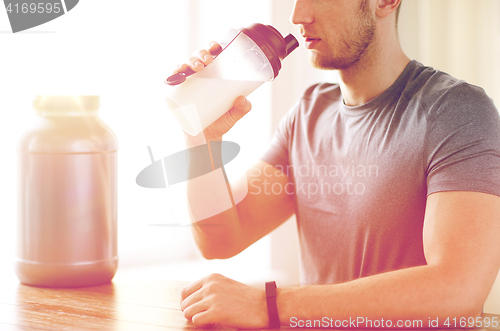 Image of close up of man drinking protein shake