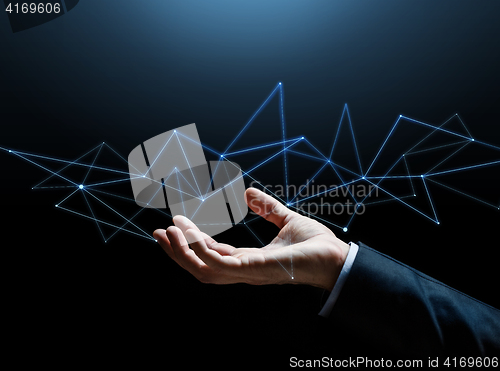 Image of close up of businessman hand with hologram