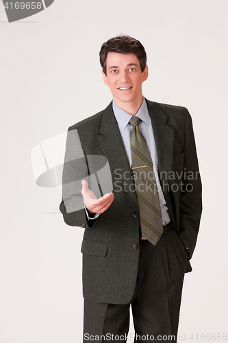 Image of Young Emotional Man In A Business Suit