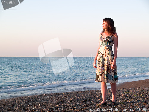 Image of Young beautiful Lady Walks along Shore