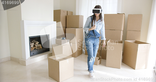 Image of Young woman using a virtual reality headset