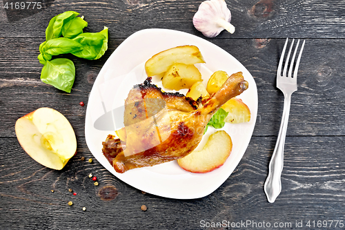 Image of Duck leg with apple and basil on board top