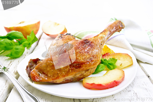 Image of Duck leg and napkin on board