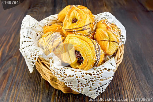 Image of Cookies with dates in basket on dark board