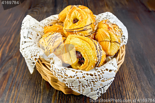 Image of Cookies with dates in basket on dark board