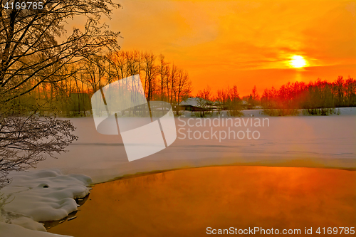 Image of Sunset on river in winter