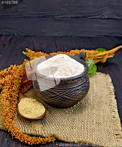 Image of Flour amaranth in clay cup with flower on dark board