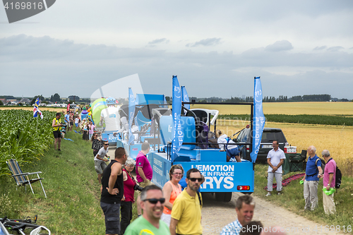 Image of Krys Caravan on a Cobblestone Road- Tour de France 2015