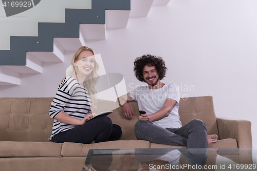 Image of couple relaxes in the living room