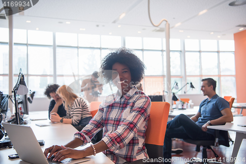 Image of African American informal business woman working in the office