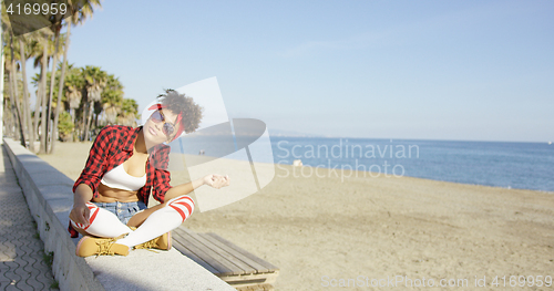 Image of Sexy fashionable young woman at the seaside