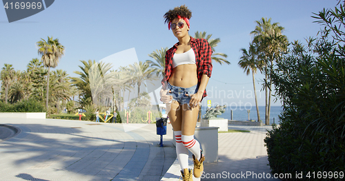 Image of Adorable african american girl walking on concrete