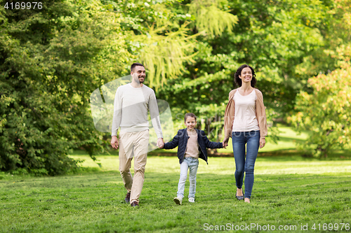 Image of happy family walking in summer park