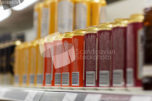 Image of close up of beer or cider cans at liquor store