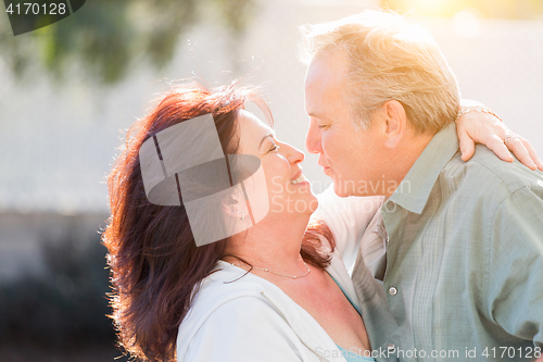 Image of Middle Aged Couple Enjoy A Romantic Slow Dance Outside