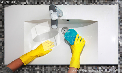 Image of washing white sink in bathroom