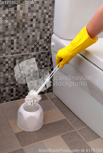 Image of cleaning white toilet bowl 