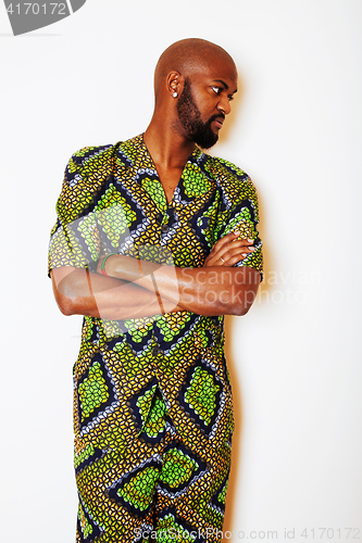 Image of portrait of young handsome african man wearing bright green nati