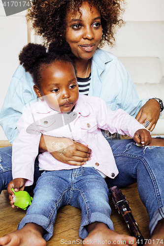 Image of adorable sweet young afro-american mother with cute little daugh