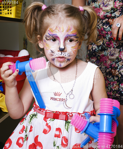 Image of little girl with faceart on birthday party, lifestyle people concept