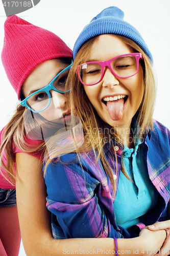 Image of lifestyle people concept: two pretty stylish modern hipster teen girl having fun together, happy smiling making selfie 