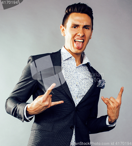 Image of young pretty business man standing on white background, modern hairstyle, posing emotional, lifestyle people concept 