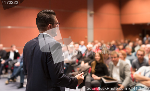 Image of Speaker giving talk at business conference event.