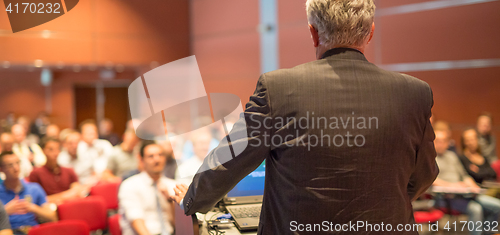 Image of Speaker at Business Conference and Presentation.