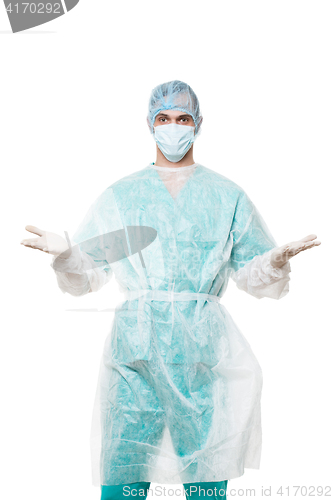 Image of Surgeon portrait. isolated on white background. spreads his arms