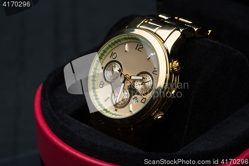 Image of gold watch isolated on black background