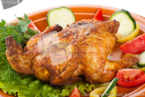 Image of fresh grilled whole chicken with vegetables