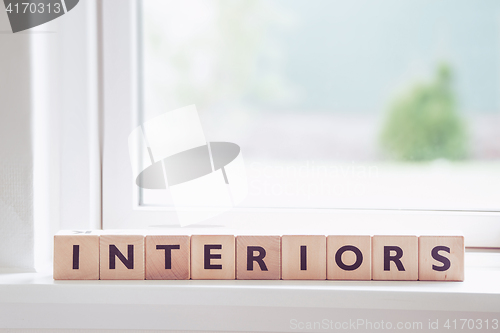 Image of Wooden interior sign in a bright room