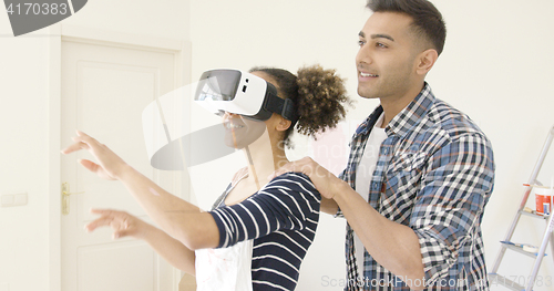 Image of Woman in overalls and virtual reality glasses