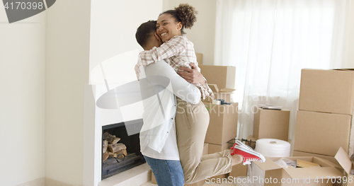 Image of Joyful young couple celebrating their move