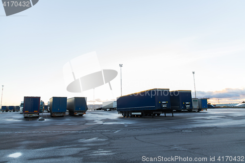 Image of trucks and trailers on parking