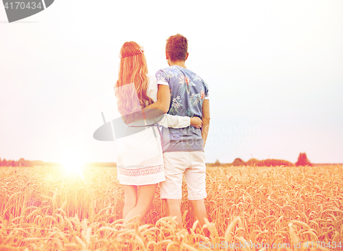 Image of happy smiling young hippie couple outdoors