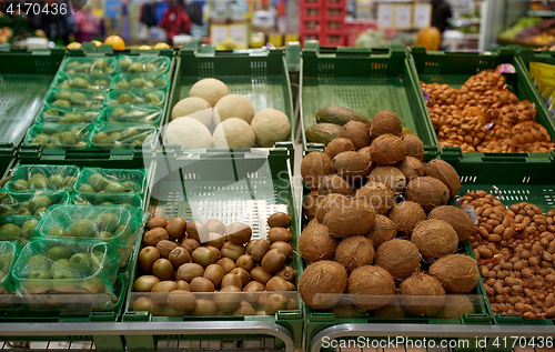 Image of fruits and vegetables on stall at grocery store