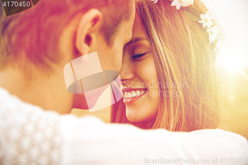 Image of happy smiling young hippie couple outdoors