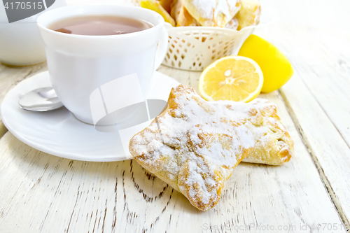 Image of Cookies lemon with tea on light board